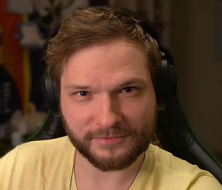 Petery at the streaming desk wearing headphones